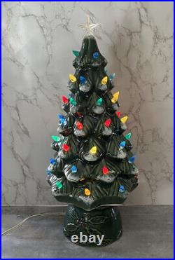 Vintage 1987 green ceramic Christmas tree with star and painted snow